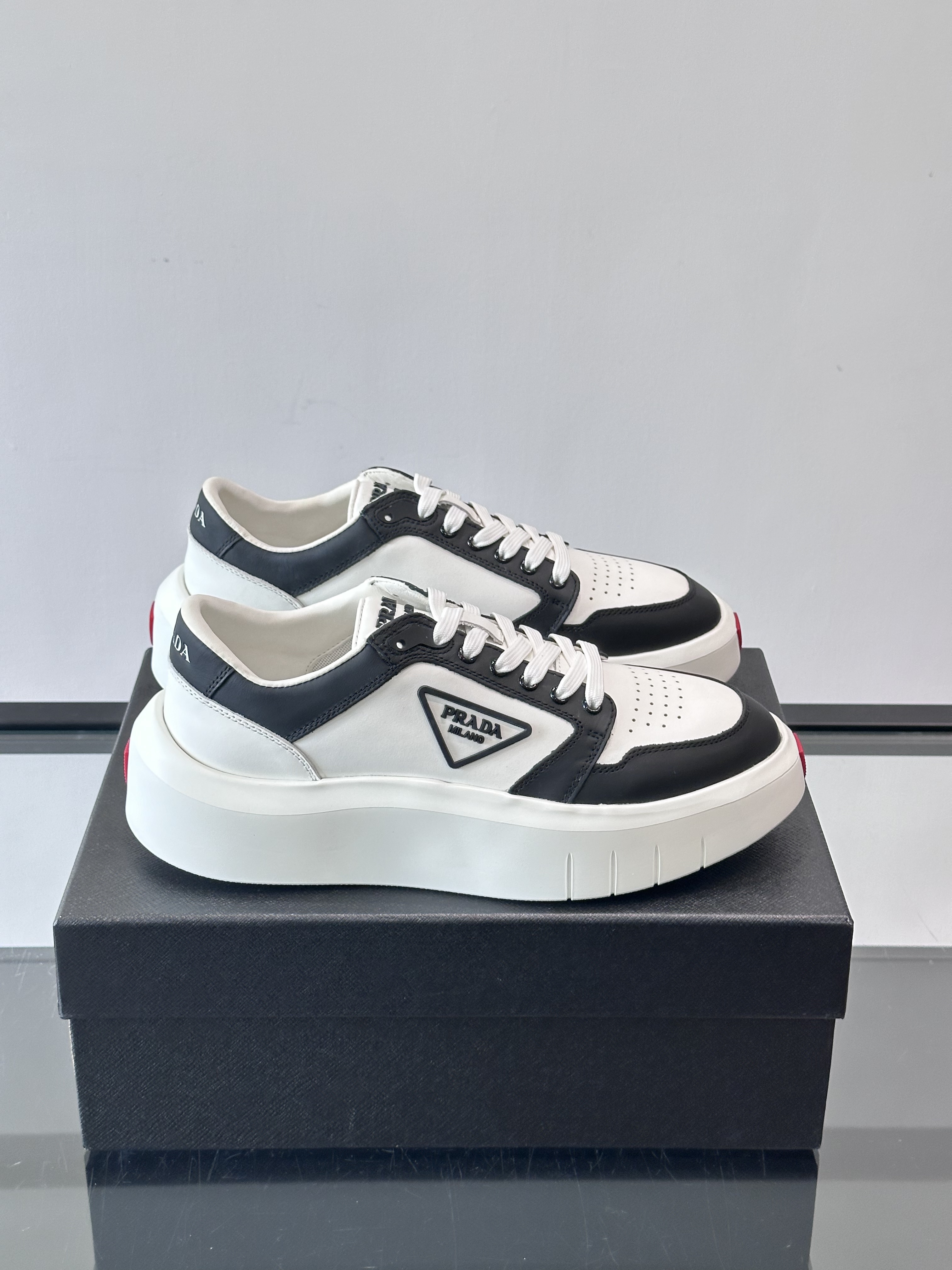 Bagsaaa Pra*a Downtown leather sneakers in a white and black colorway